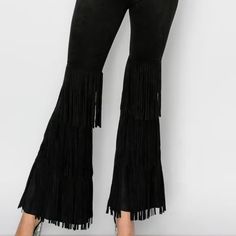 Embrace Your Everyday Style With These Fabulous Layered Fringe Faux Suede Pants. These Pants, Showcasing A Casual Aesthetic, Are Perfect For Any Occasion. Designed With A Missy Fit, They Ensure Comfort And A Flattering Silhouette. Made From 92% Polyester And 8% Spandex, These Pants Balance Durability And Stretch For All-Day Wear. The Layered Fringe Design Adds A Unique Touch, Reflecting Our Commitment To Creating Modern Looks With A Vintage Twist. Fabric: 92% Polyester 8% Spandex Party Pants With Fringe, High Waist Bottoms With Fringe For Fall, High Waist Fringe Bottoms For Fall, High-waist Fringe Bottoms For Fall, Fitted Fringed Pants For Fall, Fitted Fringe Pants For Fall, Stretch Bottoms With Fringe For Fall, Fall Stretch Bottoms With Fringe, Fall Bottoms With Fringe And Stretch