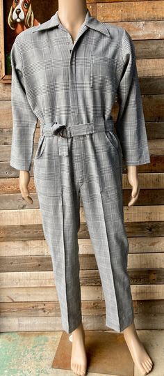 "Loving these soft coveralls by Marshall Field & Company! Features Include... Mens jumpsuit/coveralls everyday wear Soft, comfy, breatheable polyester Long-sleeved Double front zipper closure so you can zip it in two directions Elasticized waistband with attached belt One chest patch pocket Two hip pockets One back pocket Pointed collar Made by Marshall Field & Company No size tag (please see measurements for most accurate sizing) Condition... Great vintage condition with the exception of one small stain on right front pocket (please see photo) and several small snags (also shown in photos). Jumpsuit is clean and ready to wear! Measurements...  Shoulder to shoulder - 18\"  Sleeve length - 22 3/4\" Around chest, underneath armpits - 43 1/2\" Waist - 38\" with elastic for lots of stretch Hip Retro Long Sleeve Jumpsuits And Rompers For Fall, Vintage Long Sleeve Jumpsuits And Rompers For Work, Retro Long Sleeve Jumpsuit For Fall, Vintage Long Sleeve Jumpsuits And Rompers For Fall, Vintage Long Sleeve Jumpsuit For Work, Vintage Jumpsuits And Rompers For Workwear, Vintage Jumpsuits And Rompers For Fall, Retro Workwear Jumpsuits And Rompers, Retro Style Workwear Overalls And Rompers