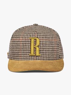 Heavyweight vintage houndstooth adjustable cap with “R” embroidered on the front. Featuring a suede brim, suede button at crown, custom Rhude hardware, and embroidered details on sides.   Commemorating our AW24 Paris Fashion Week Show "Out of Range".  RHUDE WEBSITE EXCLUSIVE WOOL VISCOSE AND SUEDEONE SIZE FITS ALL2.25" BRIM LENGTH WE RECOMMEND USING A SUEDE PROTECTOR PRIOR TO USESPOT CLEAN WITH DISTILLED SOAPY WATER Luxury Brown Hat For Fall, Luxury Brown Hat With Embroidered Logo, Classic Brown Flat Brim Baseball Cap, Classic Brown Baseball Cap With Flat Brim, Brown Snapback Hat With Embroidered Logo, Brown Snapback Baseball Cap With Embroidered Logo, Winter Brown Flat Bill Baseball Cap, Brown Embroidered Snapback Hat, Classic Snapback Flat Cap With Embroidered Logo