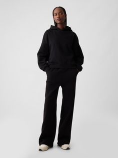 Soft fleece knit wide-leg sweatpants.  Elasticized waist.  Front slant pockets.  Seam at front.  Mid rise.  Straight silhouette with a relaxed fit.  Wide leg.  Models wearing Gap