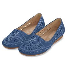 a pair of blue women's shoes with holes on the upper part and soles