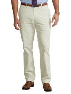 Ultra-soft stretch cotton and a relaxed fit make these chinos from Polo Ralph Lauren a comfortable classic you’ll wear again and again.97% cotton/3% elastaneFlat-front style Zip fly with a buttoned closureBelt loopsSide pockets, right hip coin pocket, back left buttoned pocket, back right button-and-loop pocket  Signature embroidered Pony above the back right pocketSize 46W has a 12½" rise and a 19½" leg openingDue to the natural characteristics of this material, the coloring may rub off onto fa Fitted Cotton Pants With 5-inch Inseam, Cotton Chinos With 5-inch Inseam And Pockets, Straight Fit Cotton Work Pants With Tapered Leg, Straight Slim Fit Cotton Pants, Straight Fit Cotton Work Trousers, Stretch Cotton Pants With Straight Hem, Slim Fit Straight Leg Cotton Work Pants, Slim Fit Cotton Straight Leg Work Pants, Classic Solid Color Relaxed Fit Chinos