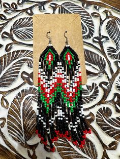 Beautiful handmade beaded earring i created would be a staple to your everyday outfit and the colors can be customizable to your likings.  I started my beading journey to reconnect with my Abenaki culture. Traditional Handmade Multicolor Tassel Earrings, Southwestern Beaded Earrings With Tassels For Festival, Southwestern Green Beaded Dangle Earrings, Traditional Beaded Fringe Chandelier Earrings, Handmade Southwestern Green Beaded Earrings, Southwestern Green Beaded Dangling Earrings, Handwoven Dangle Beaded Earrings, Traditional Beaded Earrings With Fringe And Round Beads, Traditional Beaded Fringe Dangle Earrings