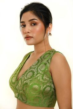 Elevate your ethnic look with this stunning Green Sleeveless Brocade Silk Blouse featuring a stylish V Neckline. Perfect for pairing with a saree or lehenga. Brocade Saree Dress With Unstitched Blouse, Traditional Sleeveless Cutdana Dress, Elegant Sleeveless Dress For Diwali, Traditional Sleeveless Lehenga With Pallu, Sleeveless Elegant Lehenga For Festivals, Elegant Sleeveless Lehenga For Festivals, Elegant Sleeveless Party Traditional Wear, Elegant Sleeveless Festival Dress, Sleeveless Chanderi Dress With Pallu