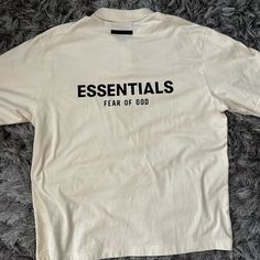 Essential Fear Of God Polo Shirt. Never Worn. This Shirt Is Oversized So Medium Is Xl Summer Long Sleeve Shirt With Logo Print, Beige Logo Print Top For Streetwear, Oversized Casual Shirt With Logo Print, Oversized Yellow Cotton Shirt, Casual Yellow Shirt With Logo Print, Beige Long Sleeve T-shirt For Streetwear, Yellow Oversized Short Sleeve Shirt, Oversized Yellow Top For Streetwear, Yellow Oversized Top For Streetwear