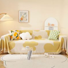 a living room filled with furniture and decor on top of a hard wood floored floor