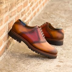 Stride into style with our Lincoln Ave. Saddle Shoe No. 8039! 🕺 Featuring a base of exquisite cognac painted calf, accented by bold reds on the saddle and tongue. 💫 Light burnishing, taupe rounded laces, and plush tan calf leather lining marry comfort with elegance. Complete with an ultra-light commando rubber sole and the durable Goodyear welt, these handcrafted wonders are your ticket to timelessly chic adventures. #ShoeGoals #ArtisanFootwear #SaddleShoeStyle 🌟 Mens Saddle Shoes, Saddle Shoe, Saddle Shoes, Goodyear Welt, Shoe Style, Cognac, Lincoln, Calf Leather, Saddle