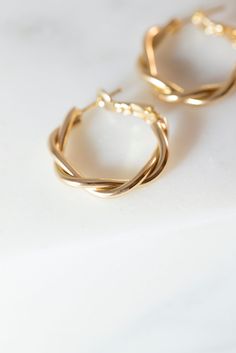 Our Dainty Twisted Hoop Earrings are a perfect, minimalist earrings to add to any outfit! Made with 14K Gold filled metal, and measure 27mm x 28mm. Available in gold. Lead and Nickle free. Twisted Gold Hoop Earrings, Pretty Jewellery Earrings, Gold Hoop Earrings Aesthetic, Girly Jewellery, Trendy Gold Earrings, Hoop Earrings Aesthetic, Little Hoop Earrings, Minimal Hoop Earrings, Twisted Earrings