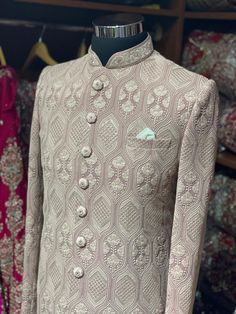 Sienna brown excellent detailing of vintage motifs accentuated with thread and sequence details with mandarin collar in cut dana and zardozi work. Available with matching churidar. Size: 38,44 Ready to Ship! Fitted Bollywood Nehru Jacket With Resham Embroidery, Bollywood Style Fitted Nehru Jacket With Resham Embroidery, Fitted Jamawar Salwar Kameez For Reception, Fitted Raw Silk Bandhgala With Intricate Embroidery, Fitted Nehru Jacket With Resham Embroidery, Brown Sets With Resham Embroidery And Long Sleeves, Brown Long Sleeve Sets With Resham Embroidery, Fitted Brocade Traditional Wear With Dabka Work, Fitted Jamawar Sherwani With Intricate Embroidery