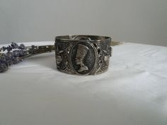 Vintage 1960s costume bracelet ,silvertone metal egyptian motifs. Measures length :8'' width: 2'' condition: excellent Shipping Is Avaliable Worldwide. Every item is carefully shipped Priority via Air Mail - shipping takes from 7 to 14 working days, depending on your location. Shipping includes Tracking. Come and check out our shop to see all items! https://www.etsy.com/shop/Themagicstories?ref=hdr_shop_menu Thanks! Note: m i n t : pristine with no signs of wear- possibly deadstock e x c e l l e 1960s Costume, Egyptian Motifs, Thanks Note, Metal Bracelet, Enamel Bracelet, Metal Bracelets, Watch Necklace, Black Enamel, Vintage 1960s