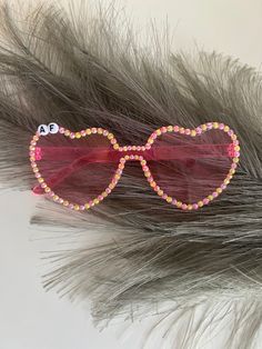 Customize these adorable sunglasses for your bridal party fun! Can be made for any theme, so please message me if you have any specific ideas. pink, heart shaped sunglasses with pink and yellow rhinestones. Fun Party Sunglasses With Heart Print, Cute Party Sunglasses With Heart Print, Fun Heart Print Party Sunglasses, Cute Heart Print Sunglasses For Party, Heart-shaped Party Sunglasses With Heart Print, Heart-shaped Sunglasses With Heart Print For Party, Pink Heart-shaped Party Sunglasses, Personalized Pink Sunglasses For Party, Pink Heart-shaped Sunglasses As Gift