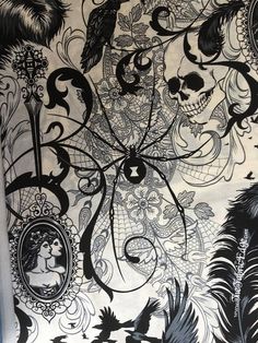 a black and white wallpaper with skulls, feathers and birds on it's side