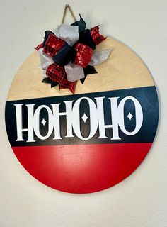 a red, white and black sign with the word hooh on it hanging from a wall