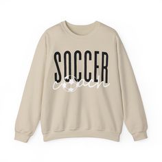 This Soccer Coach Crewneck Sweatshirt offers a cozy and stylish way for soccer coaches to show off their support during games and practices. The relaxed fit and lightweight fabric make it perfect for layering or wearing on its own. Ideal for soccer coaches looking for a comfortable and fashionable way to cheer on their team. Care instructions - Machine wash: cold (max 30C or 90F) - Do not bleach - Tumble dry: low heat - Iron, steam or dry: low heat - Do not dryclean Ideal for any situation, a unisex heavy blend crewneck sweatshirt is pure comfort. These garments are made from polyester and cotton. This combination helps designs come out looking fresh and beautiful. The collar is ribbed knit, so it retains its shape even after washing. There are no itchy side seams on these sweaters.  .: Ma Soccer Coach, Coach Shirts, Sports Coach, Gildan Sweatshirt, Soccer Coaching, Gildan Sweatshirts, Lightweight Fabric, Pullover Sweater, Pullover Sweaters