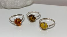 Statement small silver ring, decorated with genuine Baltic amber's the center piece in the design.Absolutely stunning everyday amber jewelry. Material : Natural Baltic Amber with sterling Silver Color : Green ,Honey ,Yellow Dimensions  :  10 mm Color green size  :   7  US Color honey  size ;  8   US Color yellow size  :  7 1/2  ,  US Finish   :  Polished All our product handcrafted. All product sent by us securely packaged. Handmade Baltic Amber Ring, Handmade Baltic Amber Jewelry, Silver Baltic Amber Rings As Gift, Baltic Amber Ring Jewelry Gift, Baltic Amber Ring For Anniversary, Elegant Baltic Amber Rings As Gift, Elegant Baltic Amber Rings For Gifts, Sterling Silver Yellow Cabochon Rings, Sterling Silver Amber Ring