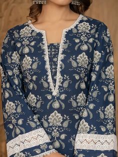 This 3-piece set includes blue cotton floral yoke print pakistani style, regular shape kurta has round neck, 3/4th sleeves, scalloped hem, calf length teamed with cotton printed trouser pants has elasticated waistband & slip on closure and a dupatta. The model wearing the size small is 5'8 in height. 3 Piece Set Color-Blue Kurta Fabric- Cotton Bottom Fabric - Cotton Dupatta Fabric-Voile Work - Floral Yoke Print detailing Neck - Round Neck Sleeves - 3/4th Sleeves Length-Calf Length Bottom - Printed Trouser Pants Bottom - Elasticated Waistband & Slip-on Closure Pocket - Single Pocket Washing Care-Machine Wash The model height 5'8 is wearing a size small Luxury Paisley Print Kurta For Eid, Luxury Cotton Salwar Kameez With Lace Work, Casual Cotton Kurta For Affordable Price, Luxury Long Sleeve Block Print Lawn Suit, Luxury Cotton Lawn Suit For Diwali, Print Kurti Designs Style, Formal Red Lawn Suit With Printed Motifs, Red Formal Lawn Suit With Printed Motifs, Printed Kurti Designs Style