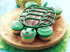 cupcakes with green frosting shaped like a turtle