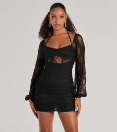 This alluring lace mini dress features a V-neckline, halter spaghetti straps with a tie-back design, sheer long balloon sleeves, and a sheer insert under the bust for a chic look. The short ruched bodycon silhouette will showcase your stunning curves.Fit & FeaturesSheer lace fabric with partial liningV-neckline, halter spaghetti straps with tie-back designSheer long balloon sleevesSheer insert under the bustRuched side and back seams, back zipper closureMini-length bodycon silhouetteRuns tru Lace Long Sleeve Mini Dress, Long Sleeve Holiday Dress, Orange Homecoming Dresses, Long Sleeve Lace Mini Dress, Purple Homecoming Dress, Backless Dress Short, Black Long Sleeve Mini Dress, Green Homecoming Dresses, Lace Dress Styles