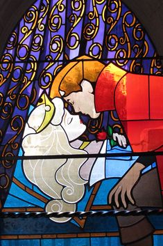 a stained glass window depicting the birth of jesus