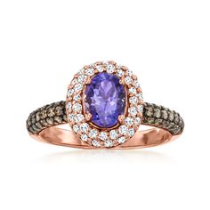 LeVian - Le Vian .60ct Blueberry Tanzanite Ring, 1.06ct t. w. Chocolate, Vanilla Diamonds in 14kt Honey Gold. Size 7. With a rich history dating back to the 15th century, Le Vian jewelry is well known for its decadent designs and innovative use of color. This exceptional ring spotlights a .60 carat oval blue tanzanite with the most vivid hue amplified by a shimmery halo of .36 ct. t. w. round brilliant-cut white diamonds. Finely crafted in polished 14kt yellow gold with .70 ct. t. w. round brilliant-cut brown diamonds dazzling along the band. Black rhodium. 1/2" wide. Le Vian diamond and blue tanzanite ring. Diamond birthstones are the perfect gift for April birthdays. Le Vian Jewelry, Levian Jewelry, Brown Diamonds, Diamond Birthstone, Le Vian, Tanzanite Ring, Blue Tanzanite, Fine Jewelery, Brown Diamond