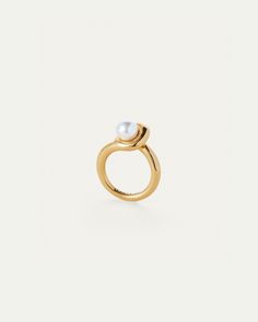 A glass pearl punctuates this modern ring with a raised profile. Finished in high-polish gold. ion-plated gold brassglass pearlfinish: high-polish product measurements:measurements taken from size 7 -length: 12.3mm / 0.48"height: 10.9mm / 0.43"glass pearl: 7.9mm / 0.31"weight: 8.9g / 0.31ozstyle: JB476imported 14k Gold Ear Cuff, Gold Bubbles, Monogram Pendant, Jenny Bird, Gold Ear Cuff, Bar Studs, Monogram Necklace, Modern Ring, Gold Brass