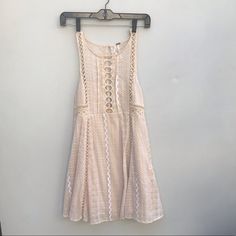 Beige And White Free People Dress, Cutouts As Shown In Pictures, Skirt And Breast Area Fully Lined. Zipper On Side, Keyhole Button Closure At Back. New Without Tags. Tag Says 10- Fits Like A Medium Or Size 6 Beige Lace Casual Mini Dress, Casual Beige Lace Mini Dress, Casual A-line Lace Mini Dress, People Dress, Diy Style, Free People Dresses, Free People Dress, Size Tag, New Dress