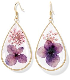 a pair of earrings with flowers painted on them, hanging from gold earwires