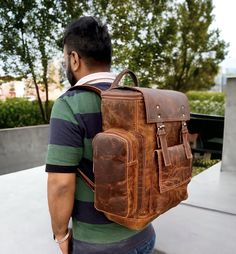 "Christmas Day Special offer Flat 70% Off With Free Shipping  ✍✍Free Personalization  Free Gift Wrapping Free Shipping 🔰 FEATURES: ◾ Unisex Backpack ◾ Made in Full-grain Leather, Excellent Quality ◾ Brown Vintage Color ◾ Padded pocket for laptop in the main compartment ◾ Antique Brass Hardware ◾ YKK Zippers ◾ 2 Pen Holder Slot ◾ Phone Holder and card Holder Slot ◾ Interior Zipper Pocket  ◾ Velvet Lining 🔰🔰 Dimensions 🔰🔰 Height :- 16 Inches Length :- 12 Inches Width :-   5 Inches 🔦Material: Womens Rucksack, Hipster Backpack, Black Leather Messenger Bag, Vintage Leather Backpack, Handmade Leather Backpack, Leather Messenger Bag Men, Laptop Bag Men, Biking Backpack, Leather Backpack For Men