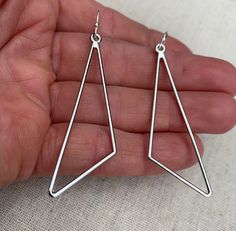 "Sleek, modern and cool! Here are some minimalist statement earrings. They have a simple modern design and would be perfect for everyday wear. The earrings measure 2 1/8\" long by 5/8\" wide. They hang from simple silver ear wire hooks. Overall drop length is 2 1/4\". Made from allergy free plated silver. Thanks for stopping by! Please take a moment and visit the rest of my Etsy shop. I have many more unique jewelry designs to choose from! 🌸 Tiger Flower Jewelry 🌸 🌸 Inspired by Nature 🌸" Modern Geometric Ear Wire Earrings, Modern Geometric Nickel-free Earrings, Modern Nickel-free Geometric Earrings, Modern Nickel-free Triangle Earrings, Modern Hypoallergenic Linear Earrings, Silver Earrings Long, Tiger Flower, Mod Earrings, Boho Hoop Earrings