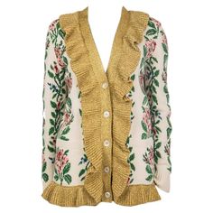 Gucci intarsia floral jacquard knit cardigan in cream, green, rose, magenta, blue, black, and gold wool (100%), metal fibers (54%), and nylon (48%). With ruffled collar, ribbed details and two pockets on the front. Closes with nacre buttons on the front. Lined in salmon, blue, yellow, and black silk (100%). Has been worn and is in excellent condition. Tag Size S Size S Shoulder Width 44cm (17.2in) Bust 100cm (39in) Waist 94cm (36.7in) Hips 94cm (36.7in) Length 74cm (28.9in) Side Seam Length 51cm Vneck Cardigan Gucci, Flower Knit, Gucci Floral, Ruffled Collar, Floral Jacquard, Jacquard Knit, Yellow And Black, Green Rose, Knit Sweater Cardigan