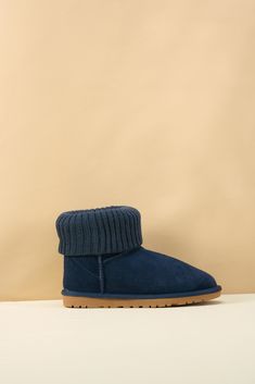 Step into cozy style with the SMAIBULUN Ugg Ankle Knit Stocking Short Boots. The ankle knit design can be folded for extra warmth, perfect for chilly days. The deep navy color adds a touch of sophistication to these versatile boots. Elevate your winter wardrobe with these must-have boots! 1'' heel 6.2'' shaft 15.2'' circumference Pull-on Lightly padded footbed Leather suede upper Faux fur lining Lightweight cushioning EVA sole Feature: Ankle knit stocking can be folded supply extra warm. Casual Winter Booties With Padded Ankle, Comfortable Warm Booties For Winter, Comfortable Warm Winter Booties, Warm Cozy Winter Booties, Casual Warm Booties With Round Toe, Casual Warm Booties For Winter, Casual Warm Winter Booties, Casual Blue Winter Booties, Cozy Warm Boots For Cold Weather