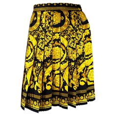 Presenting a classic gold and black baroque print Gianni Versace Couture skirt, designed by Gianni Versace. From Spring/Summer 1992, this pleated skirt boasts the brand's iconic baroque print. Approximate measurements: Size - IT44 / US10 30" waist 20.75" waistband to hem Pleated Flare Skirt, Printed Silk Skirt, Couture Skirts, Baroque Print, Gold Baroque, Versace Couture, Printed Pleated Skirt, Skirt And Top Set, Donatella Versace