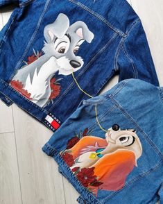 the back of a jean jacket with an image of lady and the tramp on it