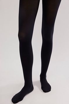 Sure to be your go-to pair to style with absolutely any outfit, these forever classic tights are featured in a staple opaque design to add the ideal finishing touch to every ‘fit. **Features:** Classic tight style, opaque finish, high-rise design **Why We ❤ It:** The ideal pair to add to your accessories collection, these wear-anywhere tights were designed to take you from the workday to the weekend. | Utterly Opaque Tights by Free People in Black, Size: XS/S Compressive Thigh High Elastane Hosiery, Compressive Thigh-high Elastane Hosiery, Elegant Compressive Elastane Hosiery, Elegant Stretch Elastane Stockings, Thigh-high Elastane Tights, Elegant Micro-elastic Elastane Hosiery, Sleek Stretch Hosiery, Black Compressive Sleek Legwear, Compressive Thigh-high Elastane Tights