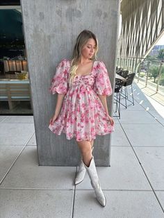 Romantic and dainty! Our Emery Mini Dress is a red, floral print, babydoll style, mini dress with big puff sleeves, ruffle detail neckline, and a hidden zipper! Throw on a pair of lace up heels to dress her up for any occasion! Style Recommendations: - Pair a heel to dress her up for a wedding! - Add an under the knee boot for a trendy, edgy, look! Product Description and Materials: - Red floral mini dress - Straight neckline, ruffle detail - Puff sleeve - Baby doll style - Machine wash cold / d Flirty Puff Sleeve Mini Dress For Garden Party, Cute Pink Puff Sleeve Dress With Floral Print, Feminine Flowy Floral Dress With Puff Sleeves, Spring Puff Sleeve Mini Dress With Gathered Neckline, Feminine Puff Sleeve Mini Dress With Gathered Neckline, Spring Mini Puff Sleeve Dress With Gathered Neckline, Spring Mini Length Puff Sleeve Dress With Gathered Neckline, Flirty Puff Sleeve Mini Dress With Floral Print, Cute Dresses With Gathered Sleeves