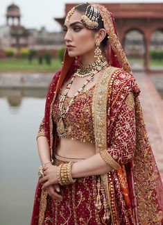 Red Golden Lehenga Choli for Pakistani Bridal Wear is emblazoned in its embroidered work on choli and golden red lehenga paired with net dupatta looking purely traditional in its design and combination of red colored on a chiffon base. Lehenga Kameez: NameerabyFarooq perfectly picked scarlet red to make the bride a sure shot show stopper Heavily embellished in mukesh aari zardozy and threadwork all exclusively embellished by our expert hand artisans. The choli is heavily embellished on the body Gold Anarkali Choli For Traditional Ceremonies, Kundan Choli For Traditional Ceremonies At Eid, Kundan Choli With Pallu For Traditional Ceremonies, Gold Choli With Dupatta For Traditional Ceremonies, Red Traditional Wear With Tilla For Eid, Traditional Red Sharara With Tilla, Red Kundan Choli For Eid, Traditional Red Anarkali Set With Tilla, Bollywood Style Red Choli With Tilla Details