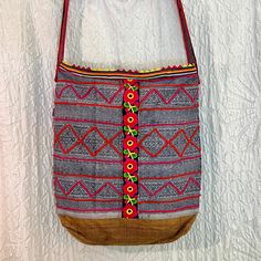 One of a kind bohemian bucket bag, handcrafted from a variety of vintage Hmong textiles. This gorgeous bag was lovingly made with vintage examples of indigo batik work, embroidery, applique, hemp, shells, beads, and tassels. All these diverse crafts brought together in a cohesive bohemian aesthetic. Lined in strong cotton, with 2 zippered interior pockets, this bag is perfect for wearing around town and whilst traveling! Bag body approximately 15" x 16" x 4" Fully lined with 2 zippered pockets inside. *please note, as with all handmade things, there will be slight variations reflecting the human who made it. We believe these "imperfections" are what make handmade things beautifully unique* The crafts of the Hmong people, amongst other Hill Tribes, are quickly becoming lost to cheap fast fa Traveling Bag, Hmong Textiles, Indigo Batik, Best Gift Cards, The Crafts, Handmade Things, Bohemian Aesthetic, Gorgeous Bags, Small World