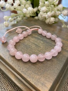 ✨This bracelet is discontinued and is part of our 50% off when you add 2 pieces to your cart. See the complete clearance selection here The incredible Rose Quartz has a hexagonal crystal system, typically pale pink color. With a translucent transparency, it is one of the most beautiful crystals. Our beautiful bracelets are adjustable to fit any size wrist. Simply pull the cords to loosen or tighten. Each crystal is .31"(8mm). These bracelets can be worn alone or stacked with our other bracelets. Adjustable Rose Gold Round Crystal Bracelet, Adjustable Round Rose Gold Crystal Bracelet, Adjustable Pink Crystal Bracelet With Gemstone Beads, Adjustable Rose Quartz Beaded Bracelets, Adjustable Faceted Crystal Bracelet, Adjustable Rose Gold Rose Quartz Bracelet, Adjustable Faceted Round Crystal Bracelet, Adjustable Rose Gold Bracelet With Rose Quartz, Rose Gold Rose Quartz Jewelry With 8mm Beads