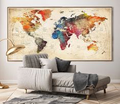 a living room with a couch and large map on the wall