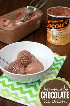 chocolate ice cream in a white bowl on a green and white napkin with spoons