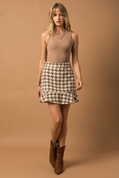 This skirt is absolutely adorable and such a statement for fall/winter! Houndstooth is such a trend right now and we are here for it. This skirt also has a friend...check out the matching jacket that you could pair with it! Trendy Lined Mini Skirt For Fall, Chic Tiered Skirt For Fall, Trendy Mini Skirt For Fall Day Out, Trendy Fall Mini Skirt For Day Out, Houndstooth Mini Skirt For Fall, Chic Fitted Houndstooth Skirt, Fall Day Out Pleated Mini Skirt, Trendy Ruffled Skirt For Fall, Trendy Fall Skirt With Ruffles