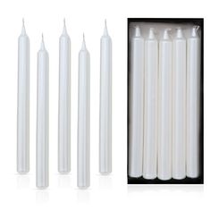 six white candles in a black box with one candle on the side and four are lined up