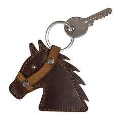 a brown leather horse head keychain with a metal hook on the end of it