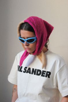 a woman wearing sunglasses and a t - shirt with the word i love sander printed on it