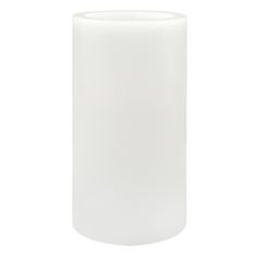 a white vase sitting on top of a table