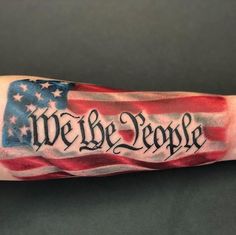 an american flag with we the people written on it is shown in this tattoo design