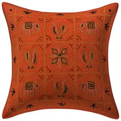 an orange decorative pillow with black accents