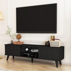 a flat screen tv mounted to the side of a wall