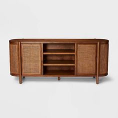 the sideboard is made out of wood and has wicker panels on one side