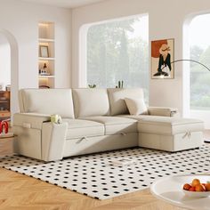 a living room filled with furniture and a white rug on the floor in front of a large window